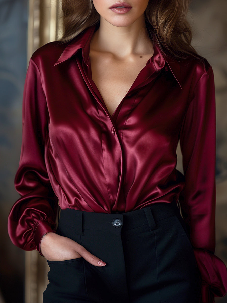 Elegante Zwarte Satijnen Blouse met Lange Mouwen